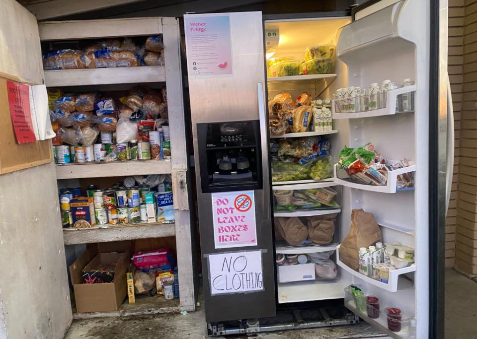 The Weber Fridge open and fully stocked with food and pantry items
